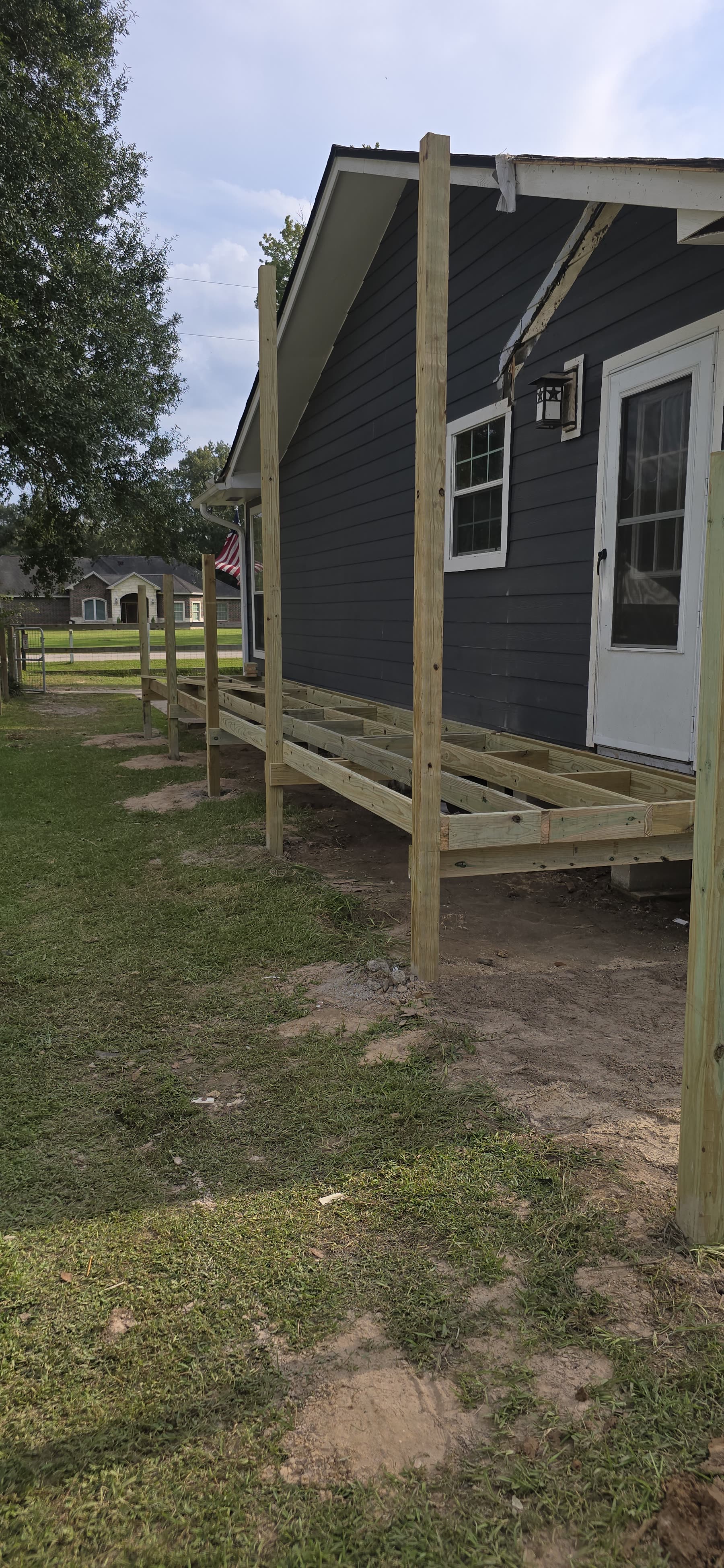 Mobile home raised on new posts after a releveling job in Polk County